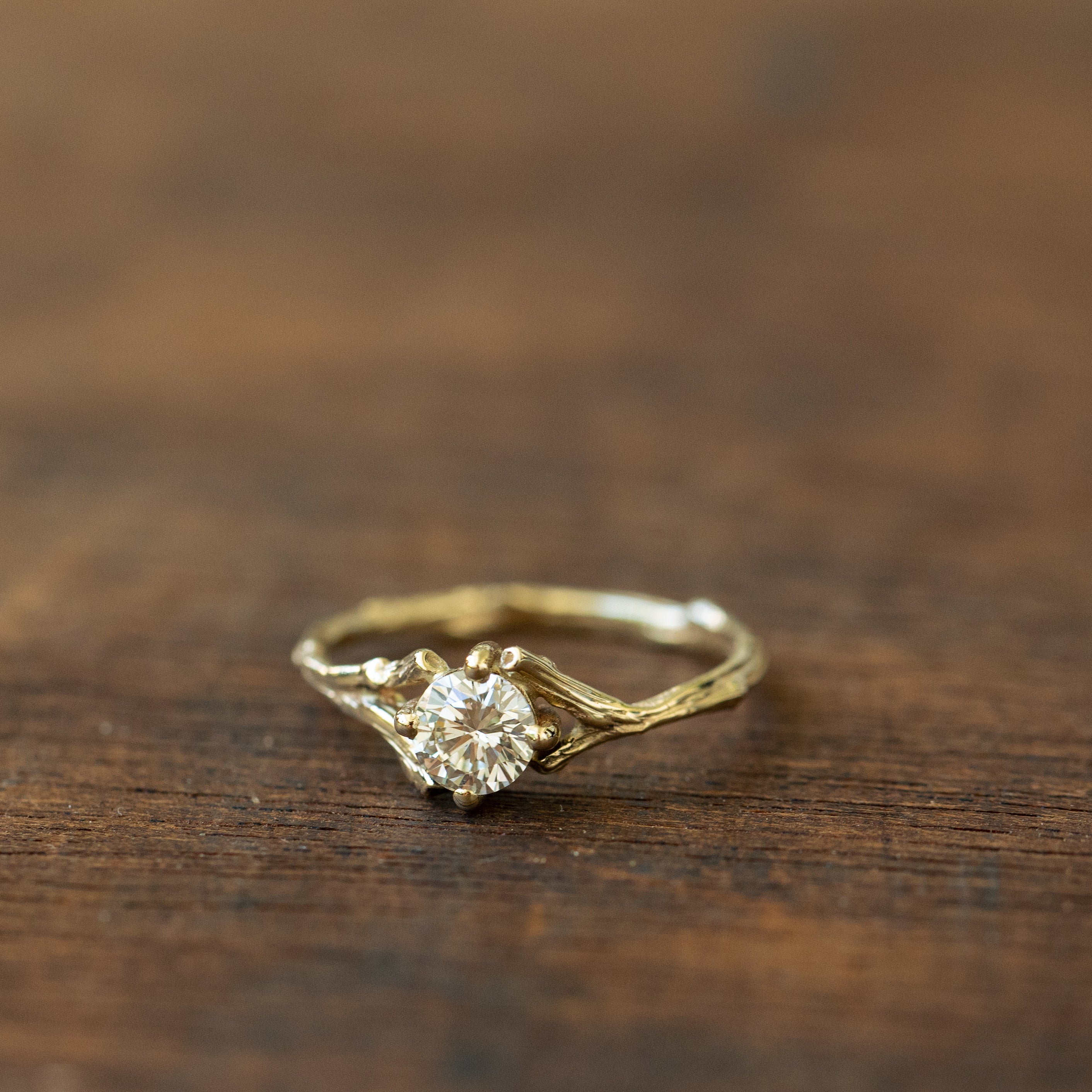 Spread branch diamond engagement ring