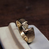 Double fingerprint ring with champagne diamond