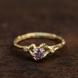 Spreading branch with purple sapphire and diamonds