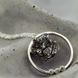 Meteorite in a round pendant