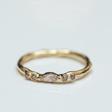 Raw symmetric ring with faint pink marquise