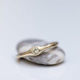 Raw ring with buried diamond