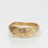 Wide Gold Band with Cracked Earth Texture and Buried Diamonds