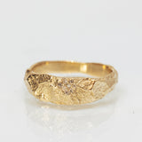 Wide Gold Band with Cracked Earth Texture and Buried Diamonds