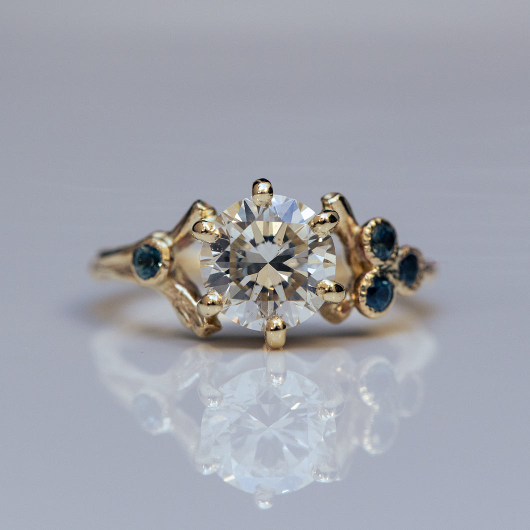 Impressive white diamond &sapphires asymmetrical spreading branch