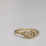 Symmetric champagne diamonds spreading branch ring