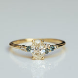 Asymmetric Oval Cluster Ring with White Diamonds and Sapphires