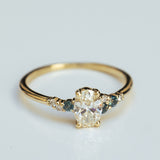 Asymmetric Oval Cluster Ring with White Diamonds and Sapphires