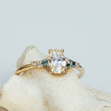 Asymmetric Oval Cluster Ring with White Diamonds and Sapphires