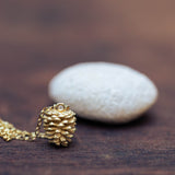 Gold plated pinecone necklace with stone