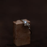 Asymmetric spread white diamonds bubble ring