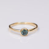 Raw bezel gold ring with Parti sapphire