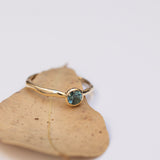 Raw bezel gold ring with Parti sapphire