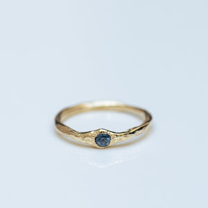 Raw gold ring with buried parti sapphire