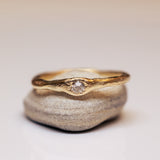 Raw ring with buried diamond