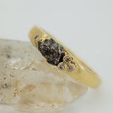 Narrowed gold ring with meteorite & diamonds