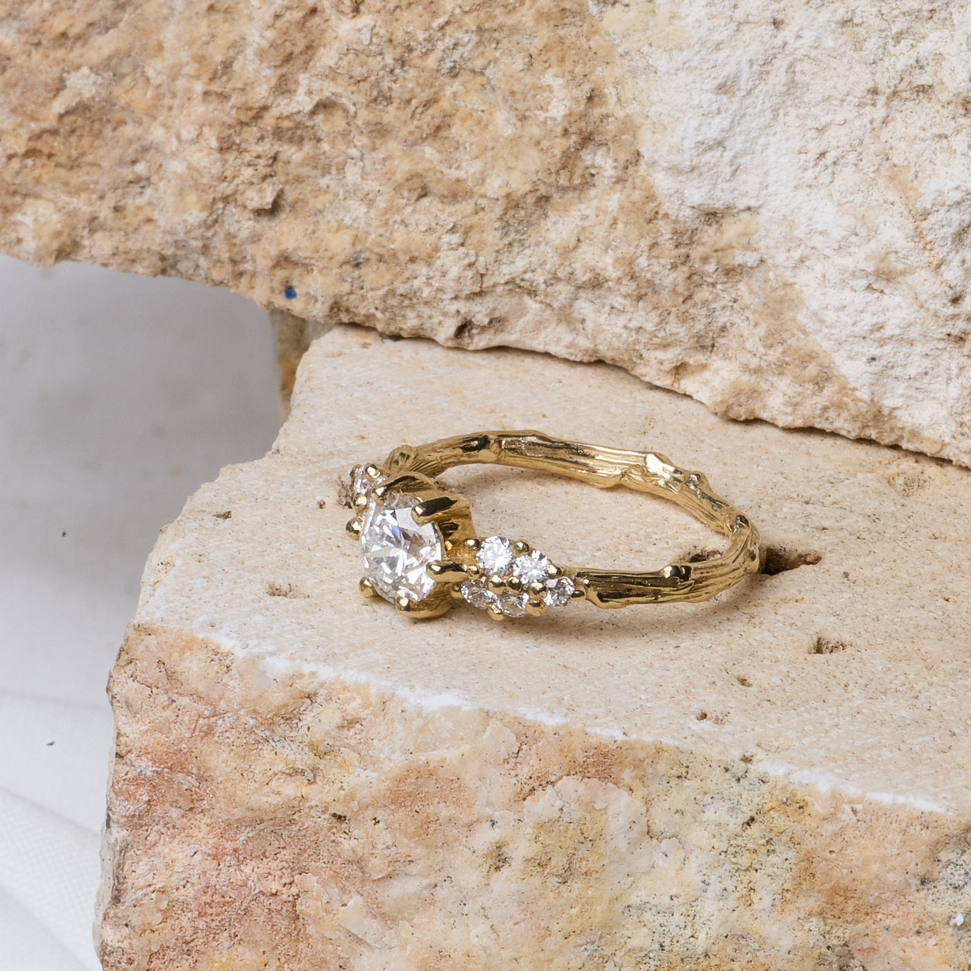 Bespoke organic gold necklace with meteor pendant on river stone