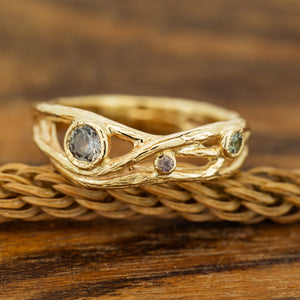 Large serpentine branch ring with sapphires