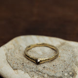 Raw diamond burried in raw gold ring