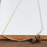 Duo pinecones on a branch necklace
