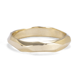 Faceted Gold Ring with Flowing Wave Design