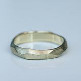 Faceted Gold Ring with Flowing Wave Design
