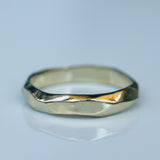 Faceted Gold Ring with Flowing Wave Design