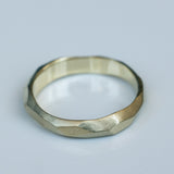 Faceted Gold Ring with Flowing Wave Design