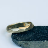 Faceted Gold Ring with Flowing Wave Design