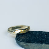 Faceted Gold Ring with Flowing Wave Design
