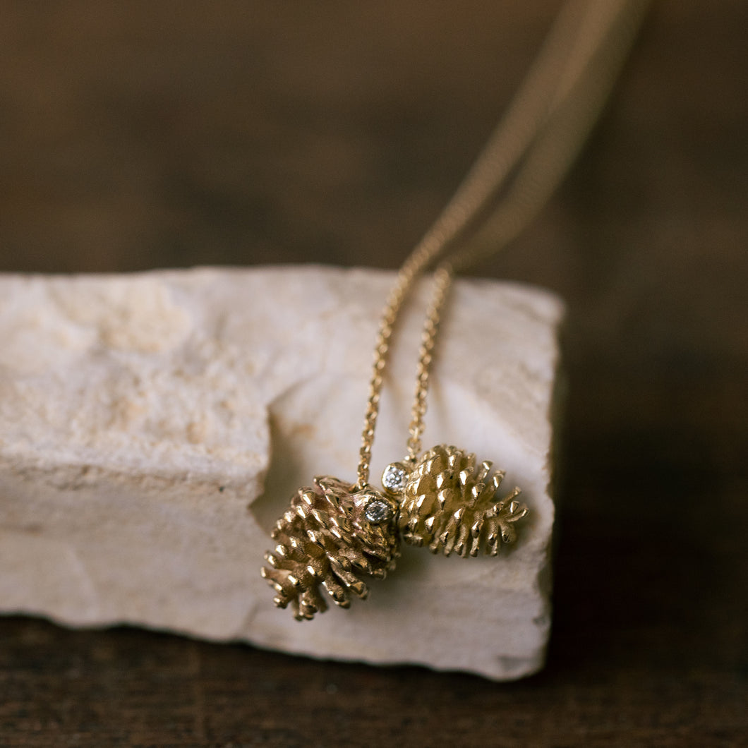 Duo 14k gold pinecone pendants set with diamond
