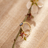 Blue-purple sapphire gold solitaire ring