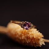 Pink oval sapphire cluster ring