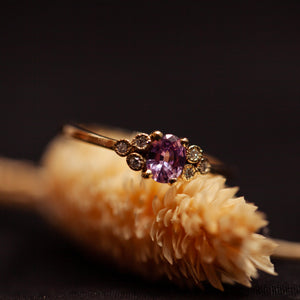 Pink oval sapphire cluster ring