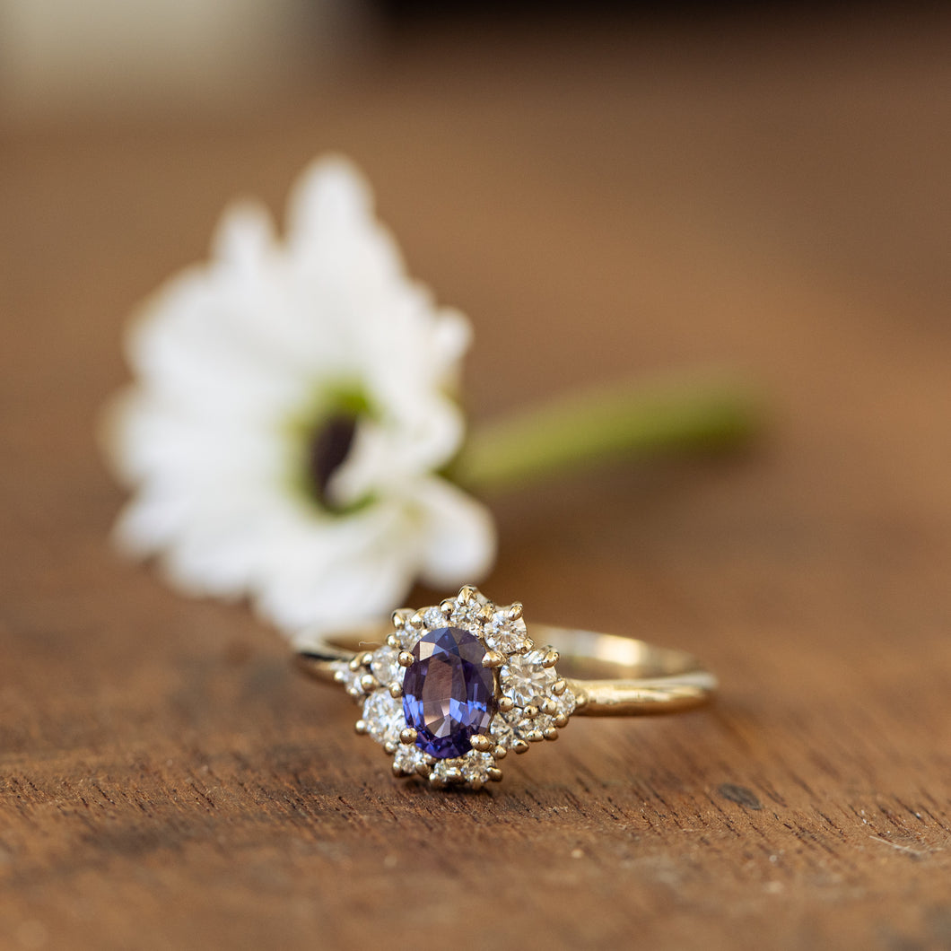 White diamonds & purple sapphire cluster ring