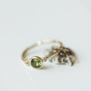 Asymmetric branch ring with green sapphire