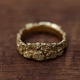 Narrowed cracked bark gold ring