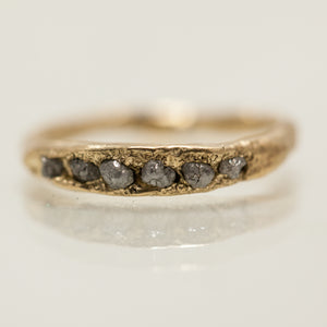 Rough concave ring with deep raw diamonds