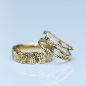 Crossed branches with sapphires &  tree stump wedding rings