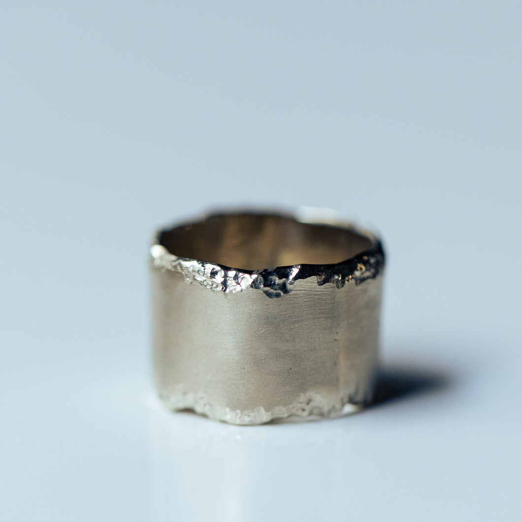 Wide chiseled white gold ring