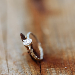 White oval diamond branch ring