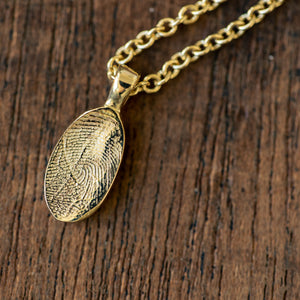 Oval fingerprint gold pendant