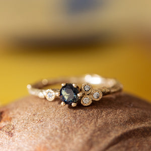 Blue sapphire asymmetric cluster ring