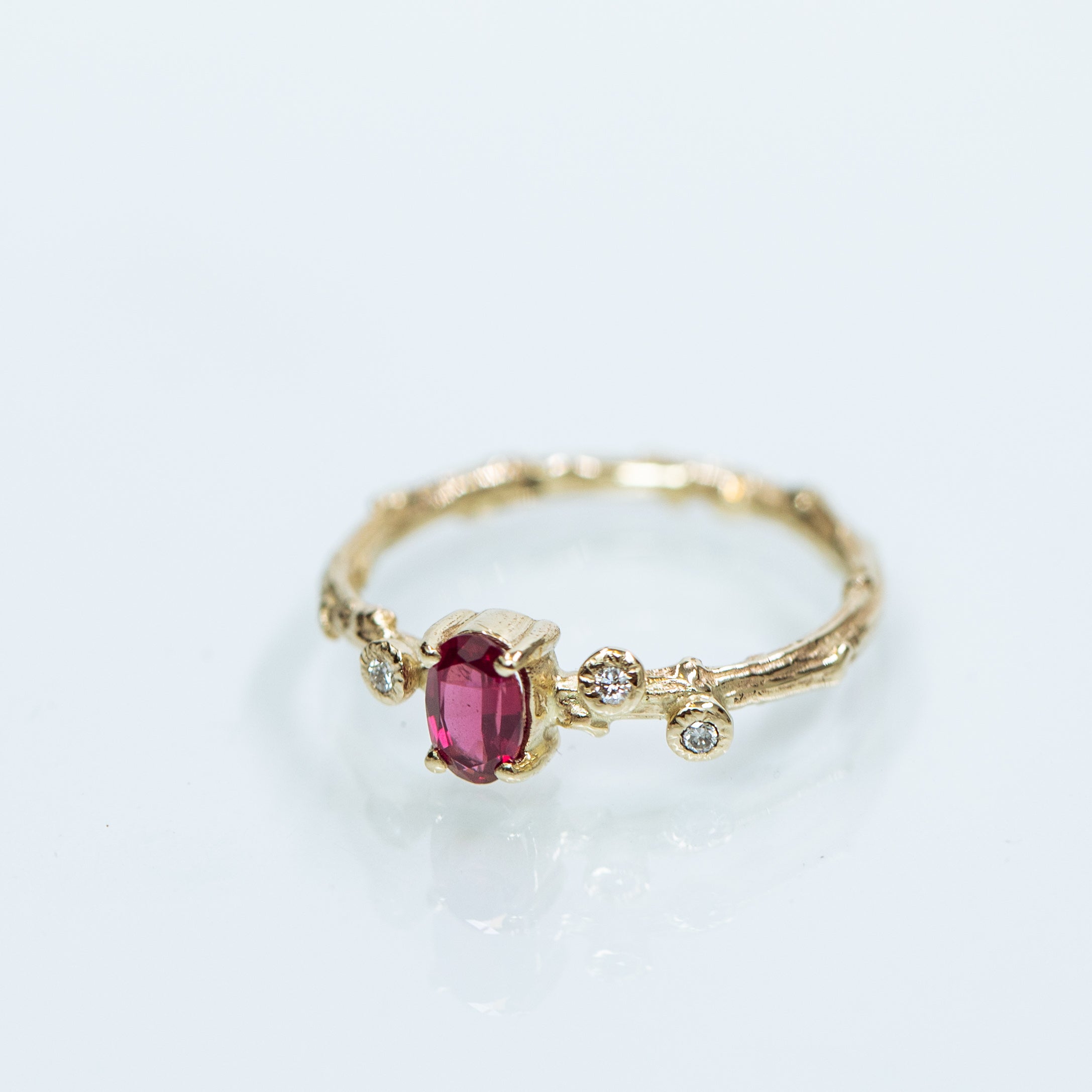Oval ruby & diamonds branch ring