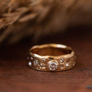 Scattered diamonds engagement ring