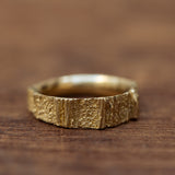 Narrow grooved gold ring