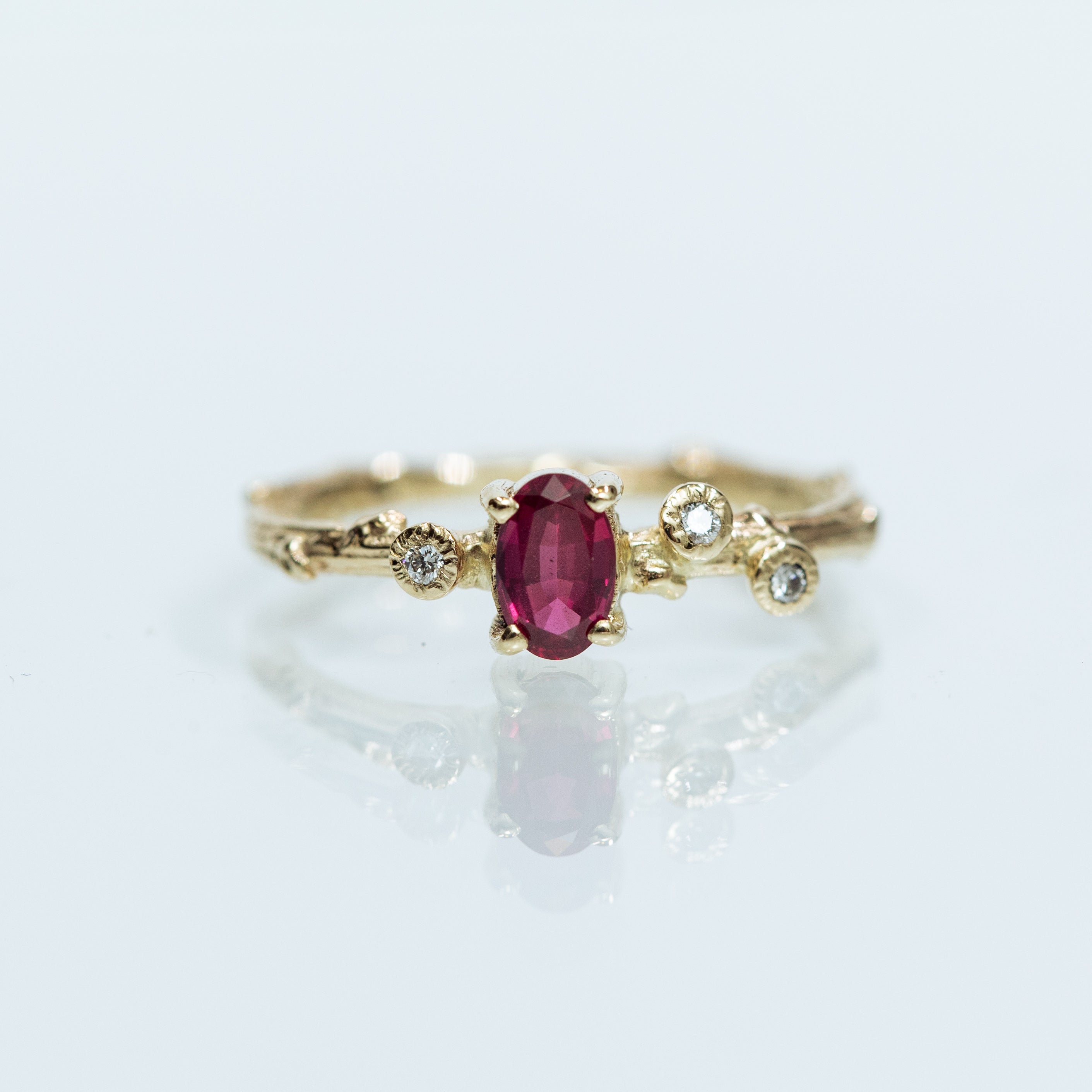 Oval ruby & diamonds branch ring