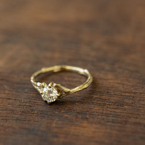 Spread branch diamond engagement ring