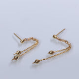 Asymmetric gold seeds chain earrings