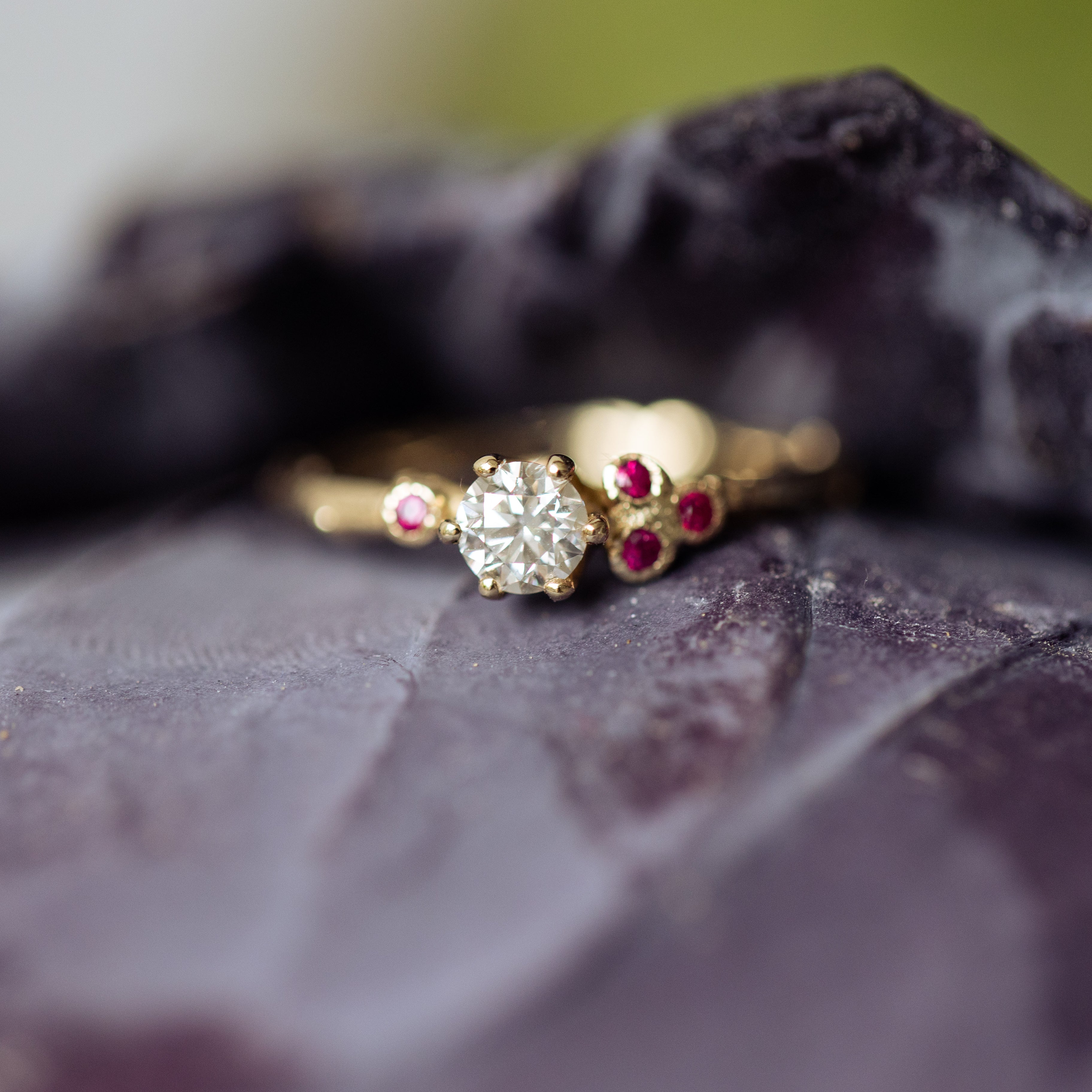 Asymmetric cluster ring with rubies